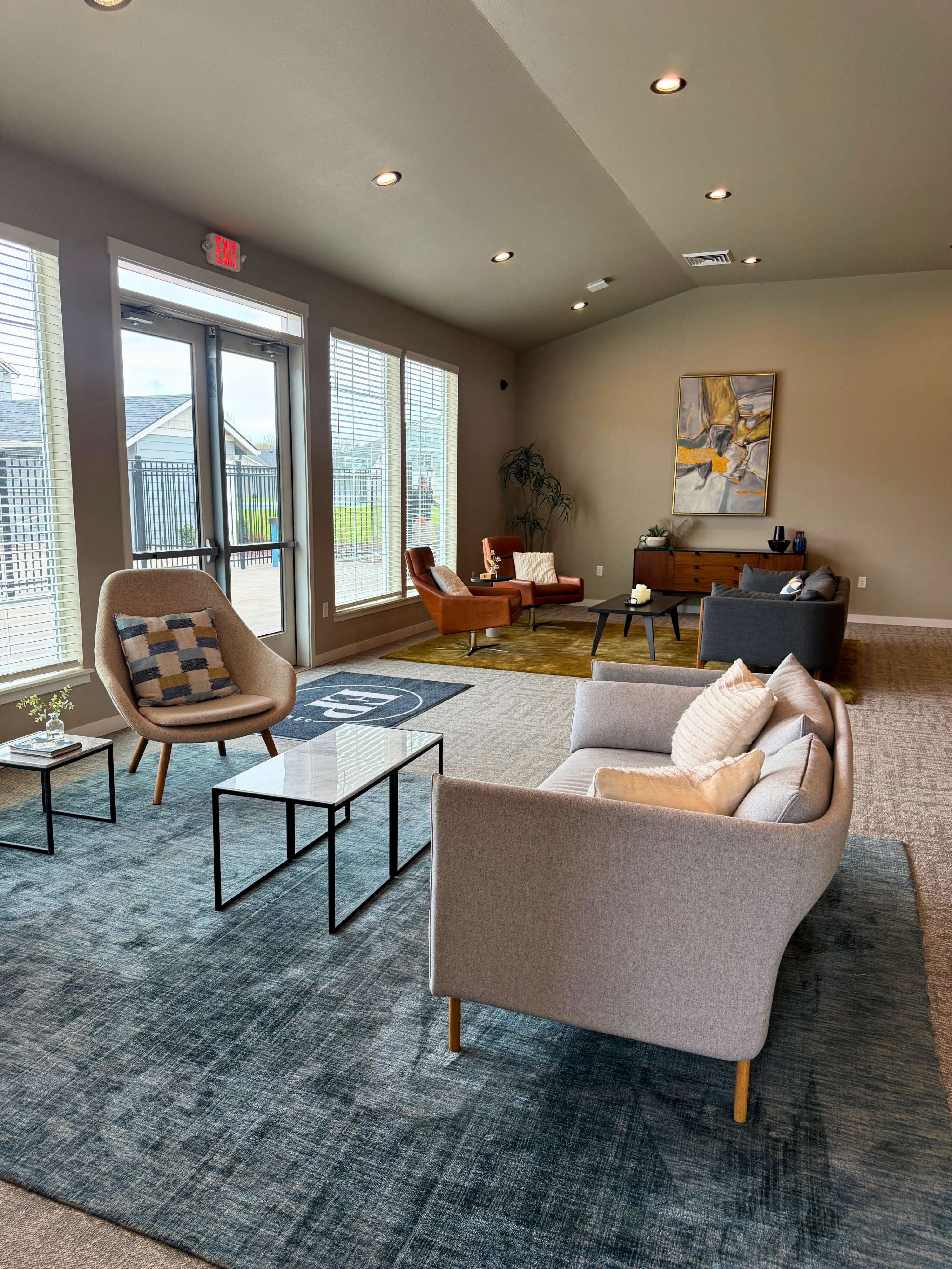 Chic and modern lounge area with plush seating, large windows, and contemporary decor, offering a welcoming and stylish ambiance.
