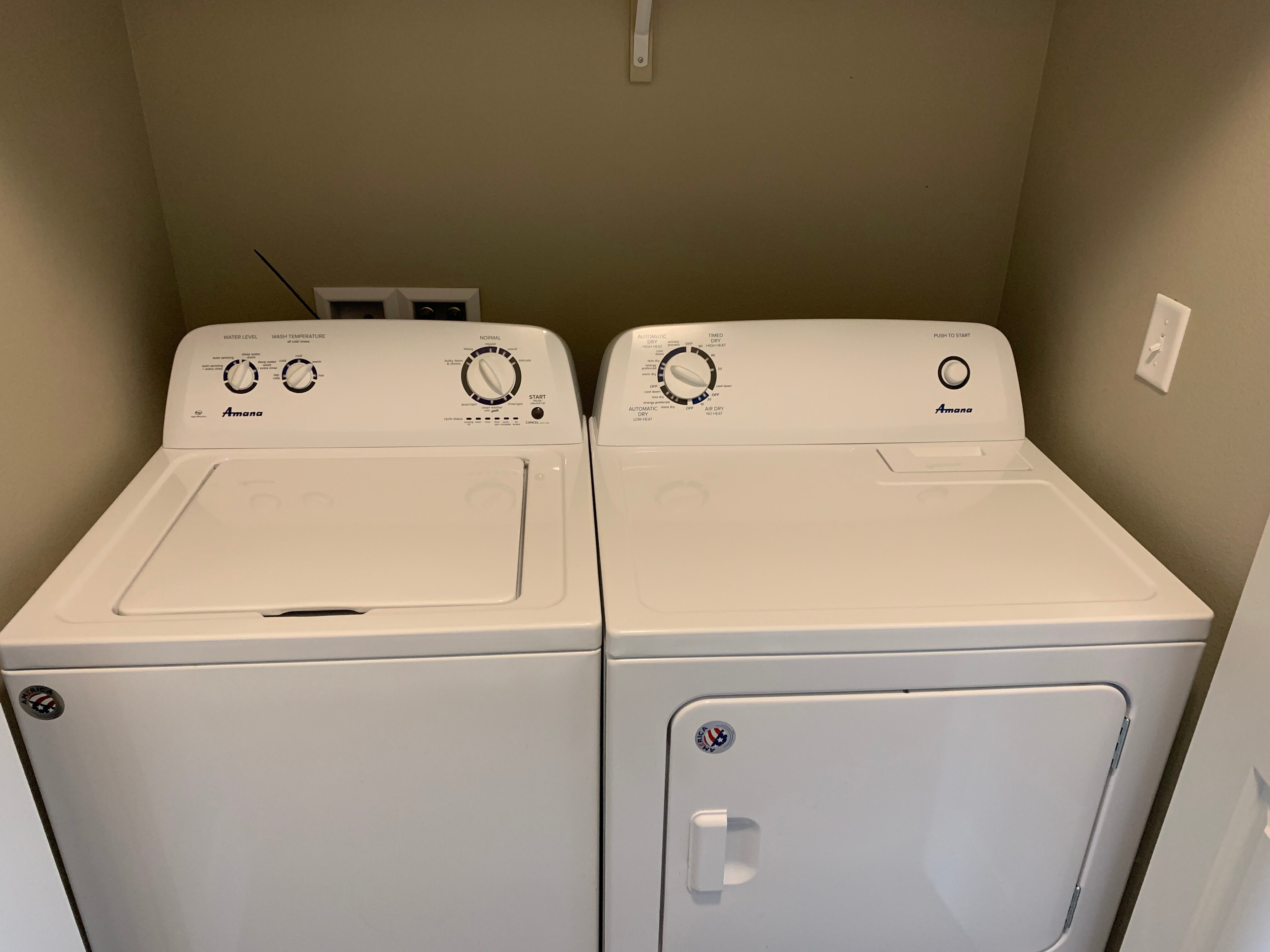 Modern laundry room featuring a sleek washer and dryer set, offering convenient in-home amenities.
