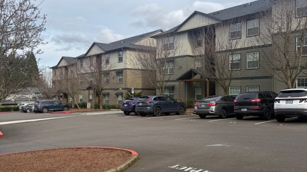 Charming apartment complex with ample parking and serene surroundings, ideal for comfortable living.
