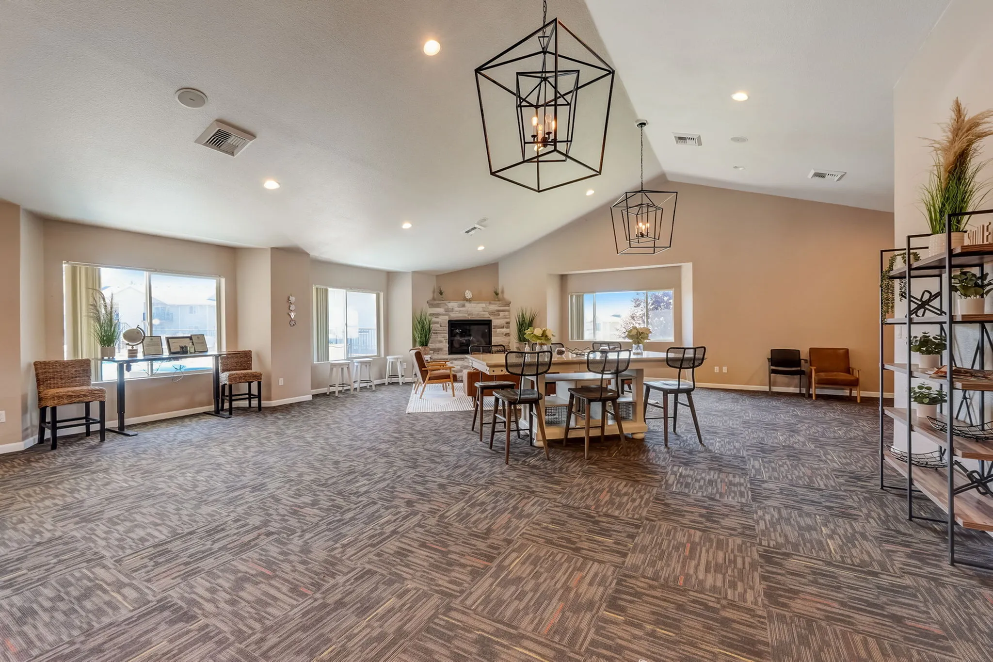 Spacious and elegant dining area with modern lighting, cozy fireplace, and stylish seating, perfect for gatherings.