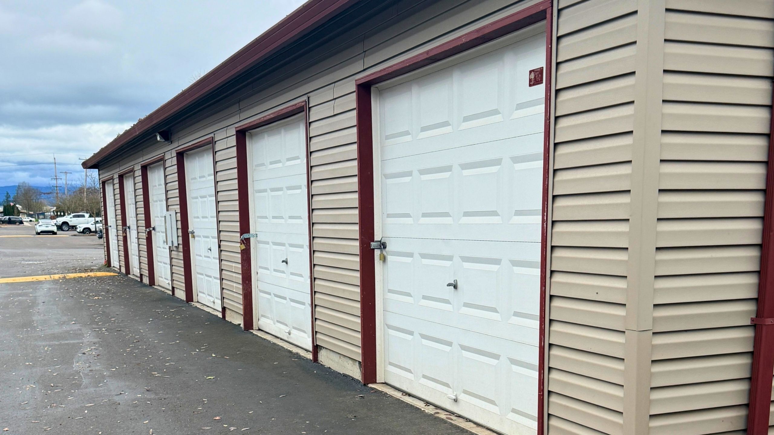 Secure self-storage facility featuring multiple units with locked, easy-access roll-up doors.