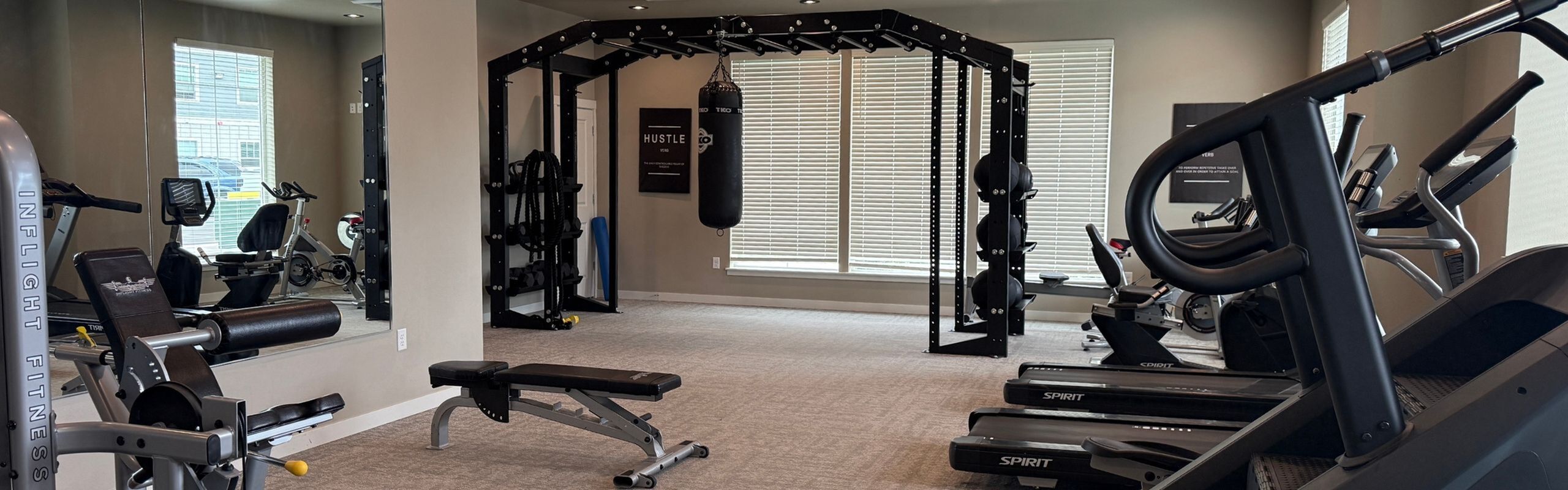 Modern fitness center with state-of-the-art exercise equipment, free weights, and a motivational atmosphere.