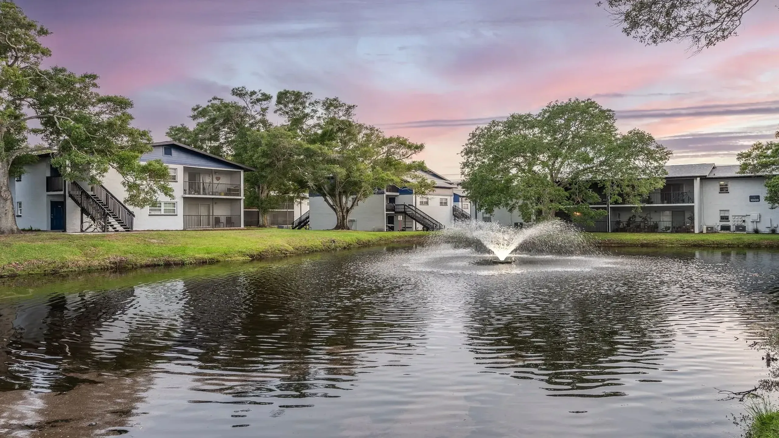 Luxurious swimming pool area with elegant wooden pergolas, relaxing lounge chairs, and lush greenery, perfect for unwinding and enjoying sunny days.