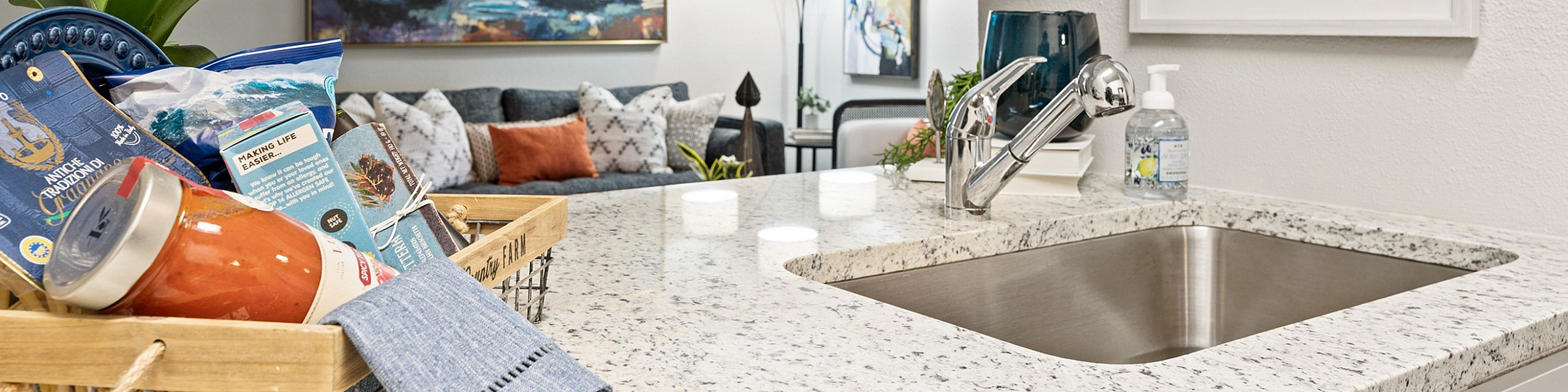northside heights conroe texas apartments close up of kitchen and view of livingroom in model