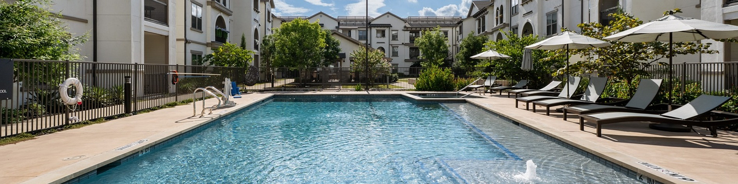 interior courtyard with sparkeling heated pool and spa sun loungers golf putting range gas grills and so many more amenities