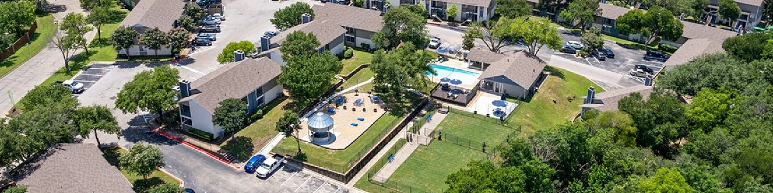 hilltop apartments in templeaerial view of all the fabulous outdoor amenities the silo gazebo the cornhole toss games charcoal grills and picninc tables as well as two large dog parks a dog wash station large pool and lounging deck