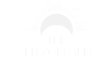Elegant logo design featuring a stylized sun above 'The Fitzgerald' text, symbolizing luxury and sophistication.
