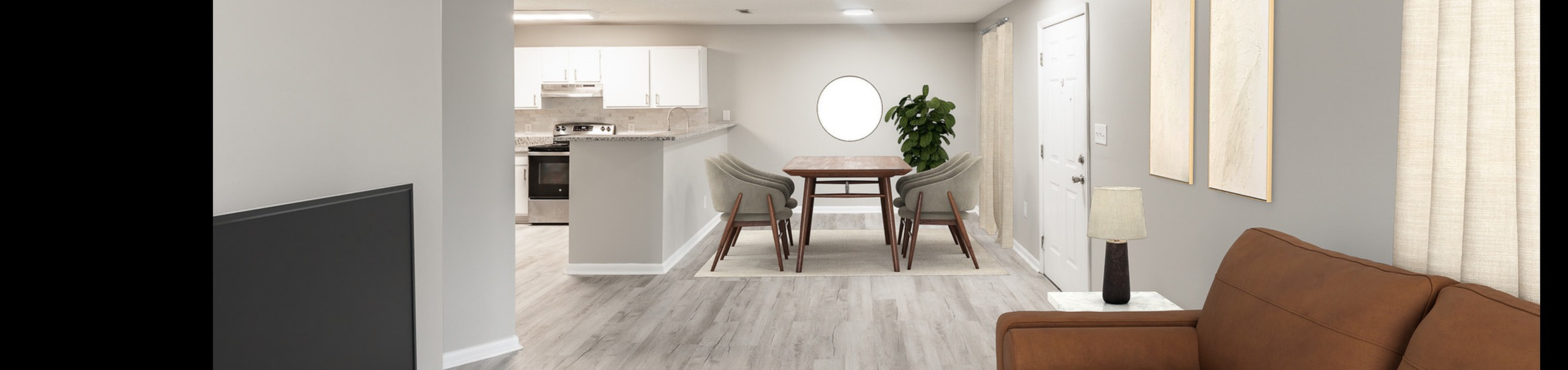 Virtually staged modern living room with sleek brown sofa, stylish geometric rug, and open dining space leading to a contemporary kitchen with clean white cabinetry.