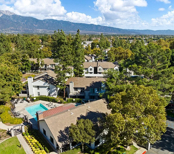 Arial view of the community with mountains in the background.