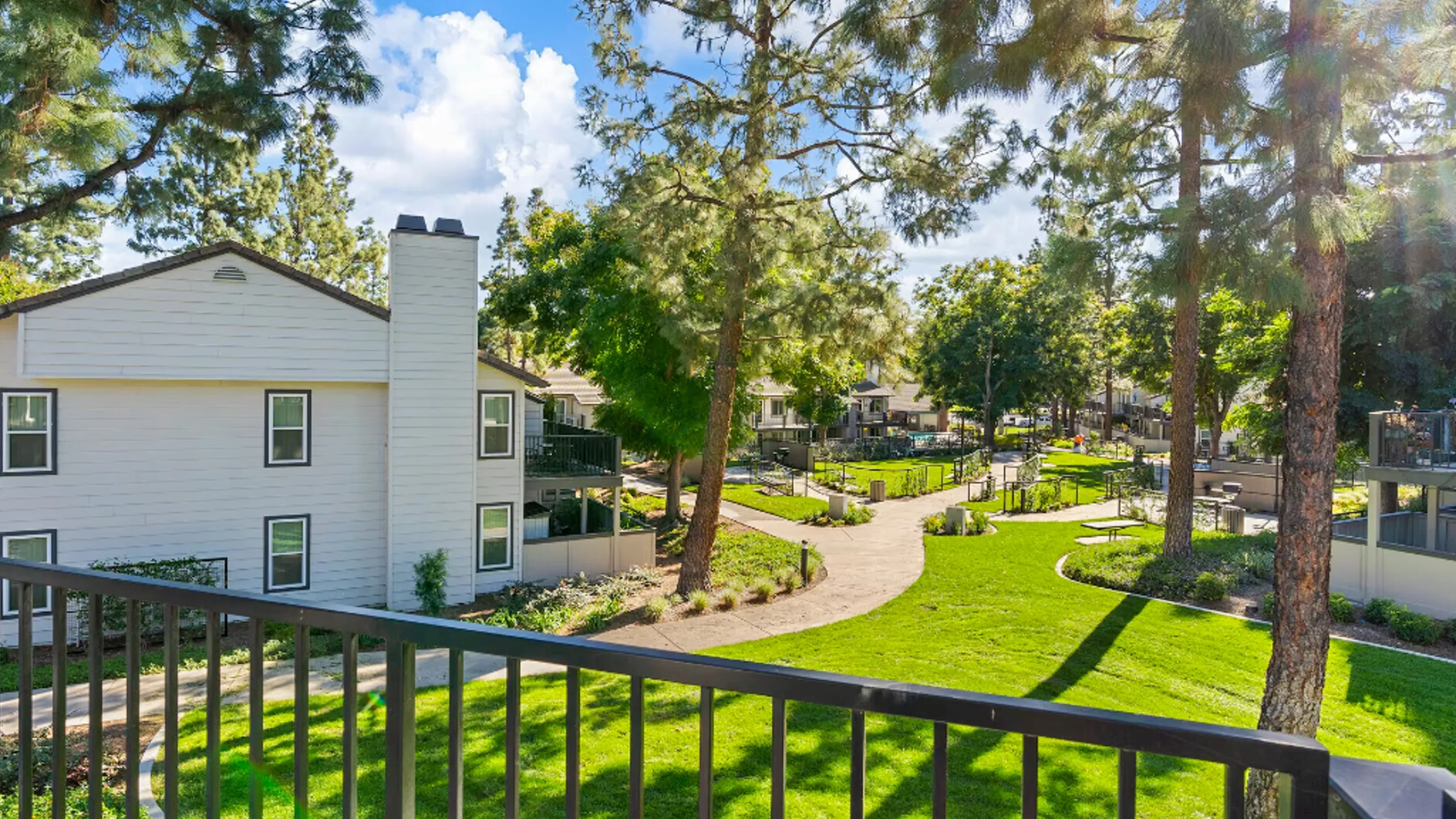 View from apartment balcony to central park area of property.