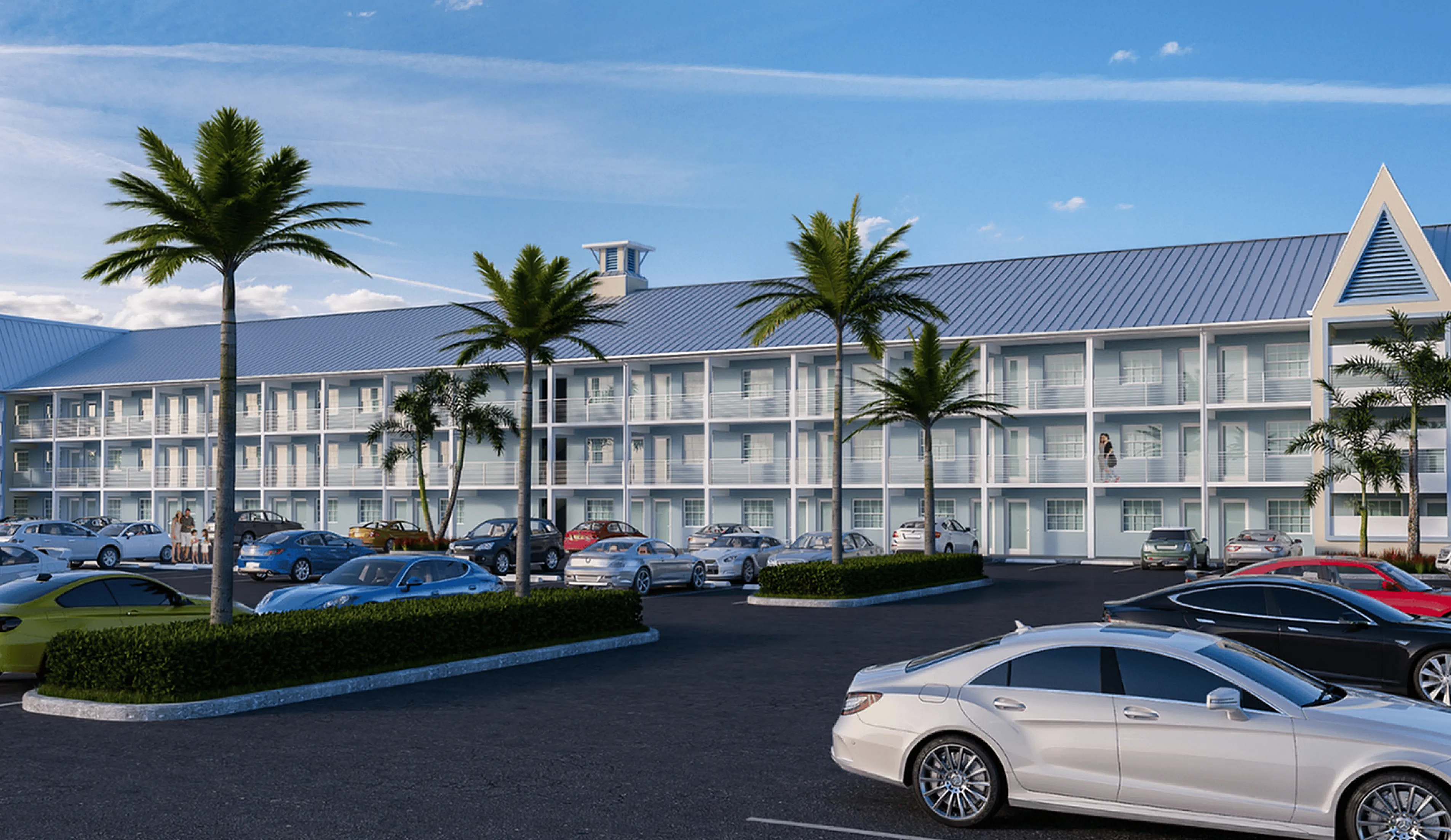 Elegant apartment complex in Kissimmee, Florida showcasing modern architecture with spacious balconies and palm-lined parking area.