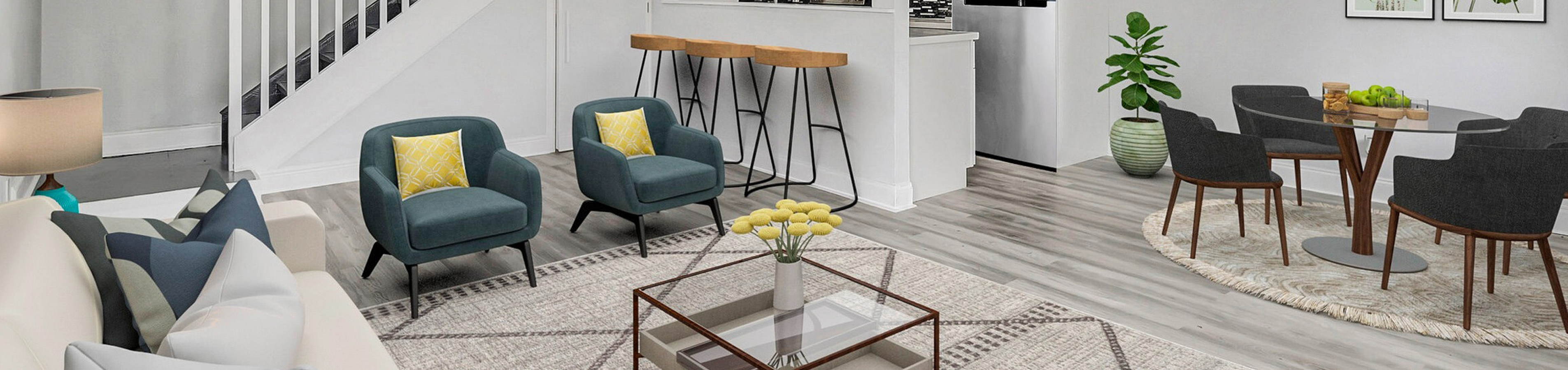 Contemporary open-layout living room with elegant seating and modern kitchen, ideal for stylish entertaining.