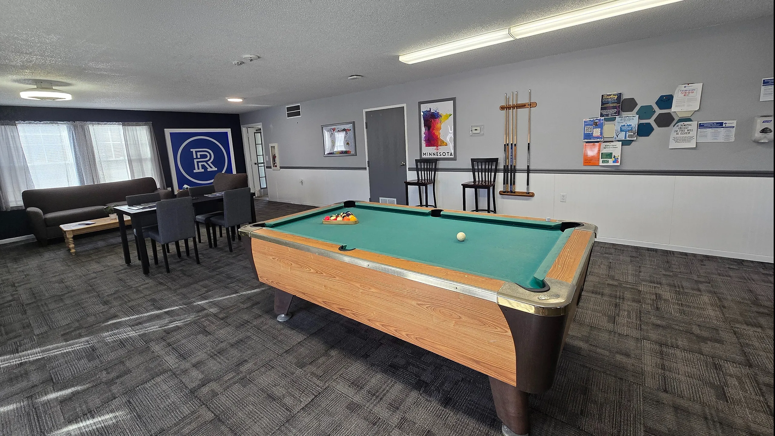 Community center with pool table and sitting area