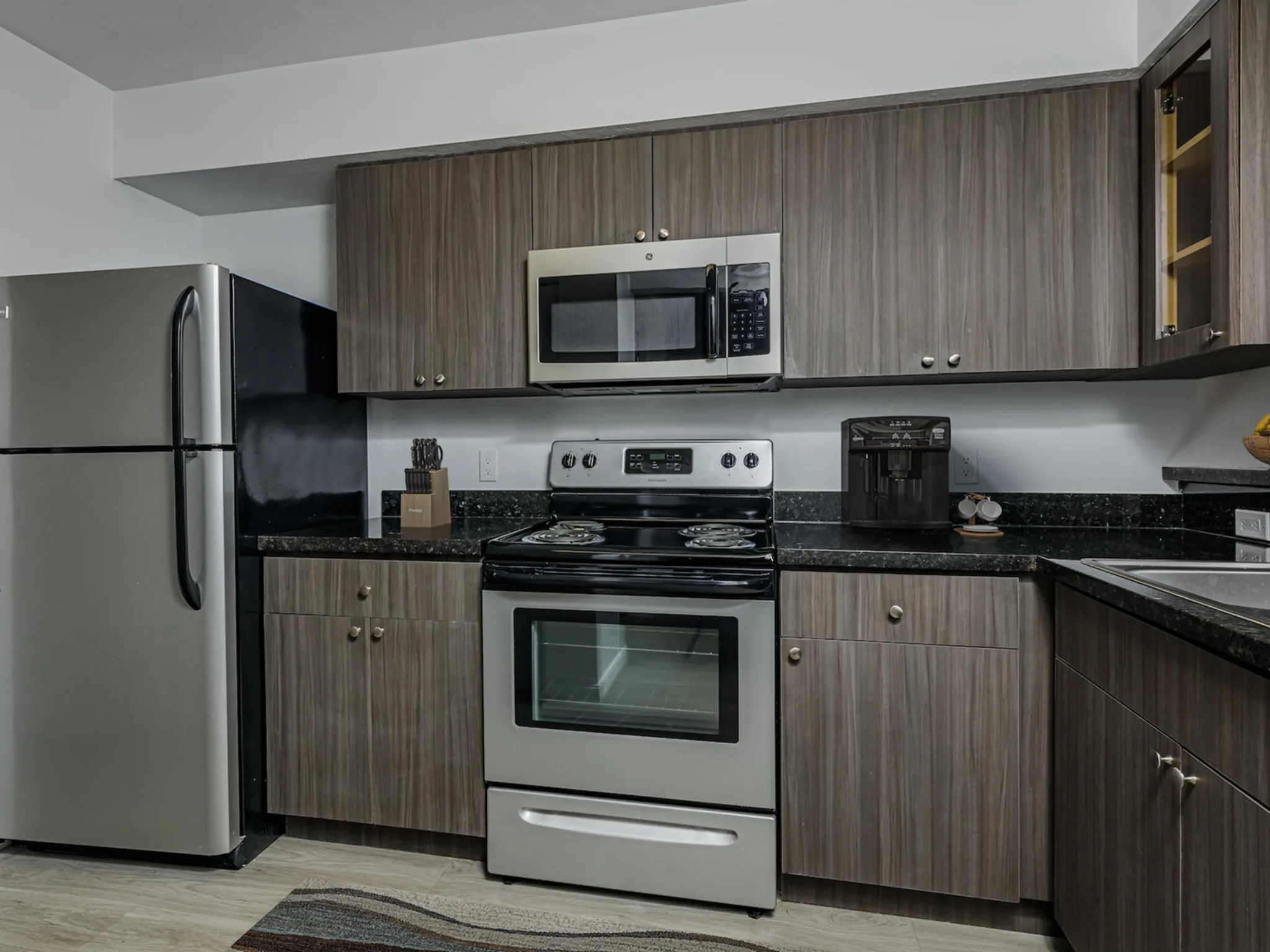 Kitchen with cabinets and appliances.