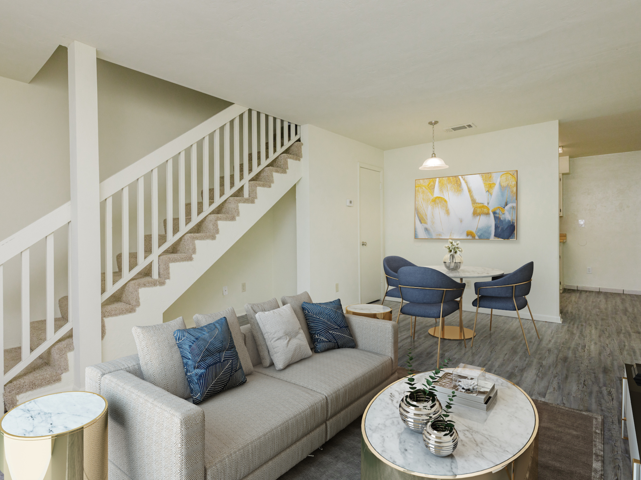 Living and dining area with couch, coffee table, dining table and chairs.