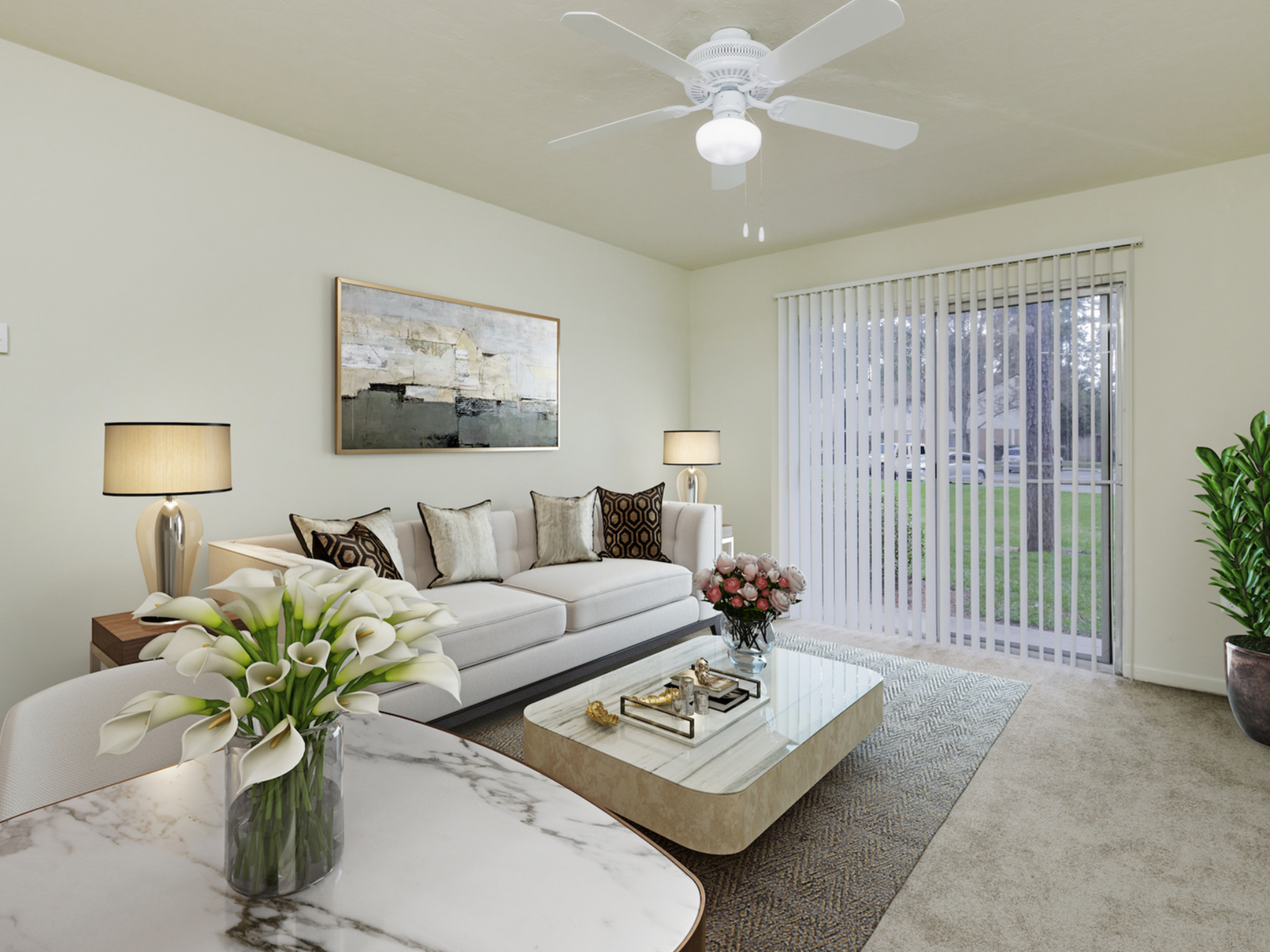 Living and dining area with couch, coffee table, dining table and chairs.