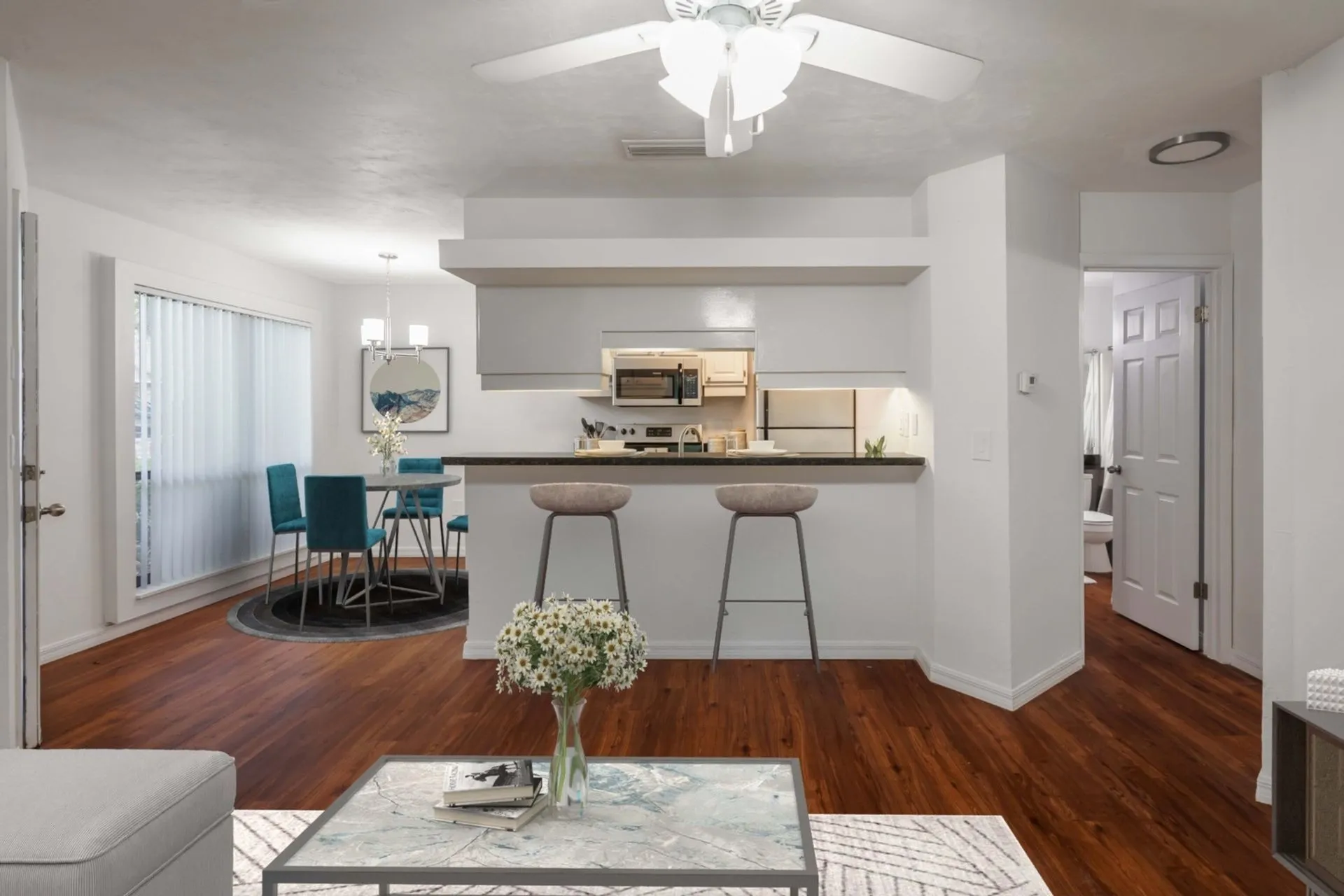 Living room overlooking kitchen with breakfast bar and dining room
