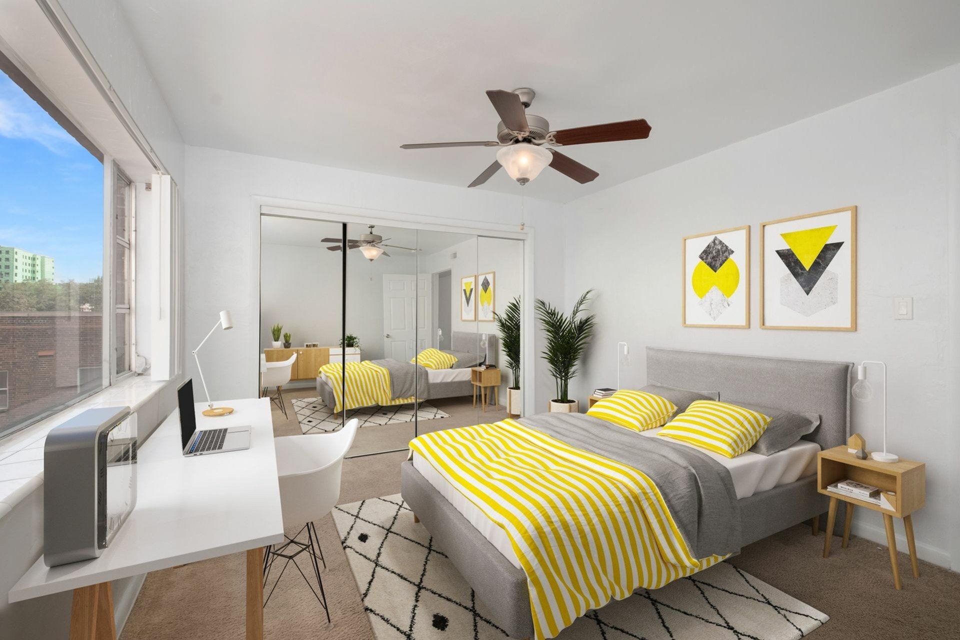 Penthouse bedroom with bed and desk