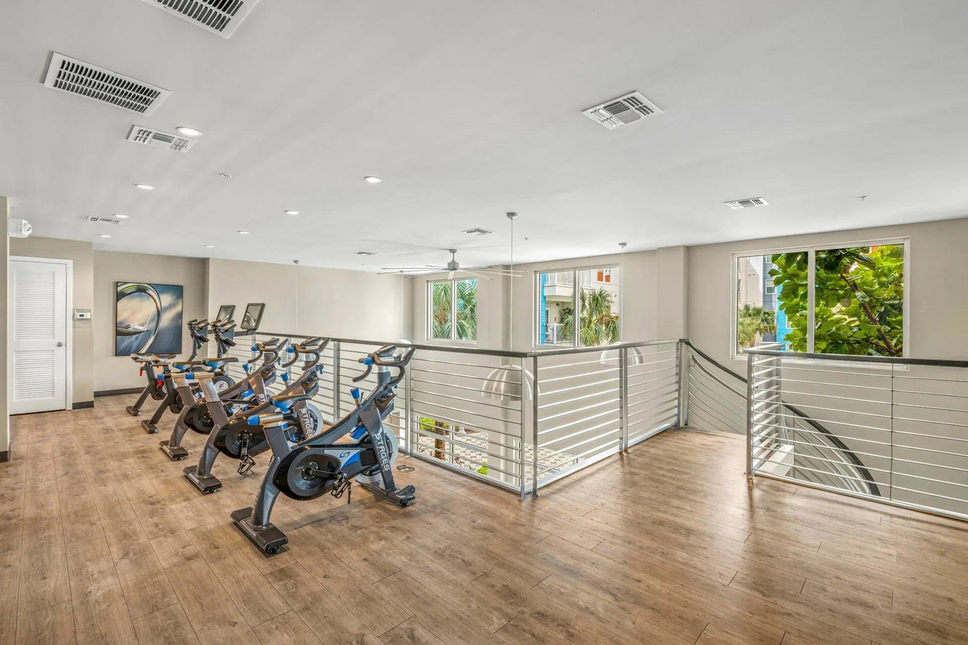 Community fitness center with various cardio and weight machines.
