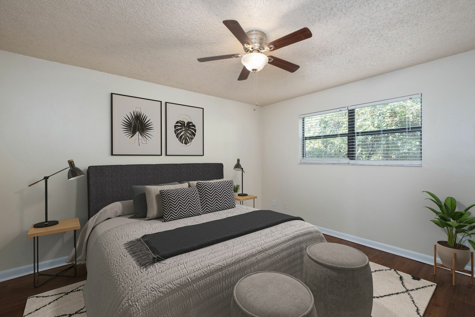 Bedroom with gray bed and window