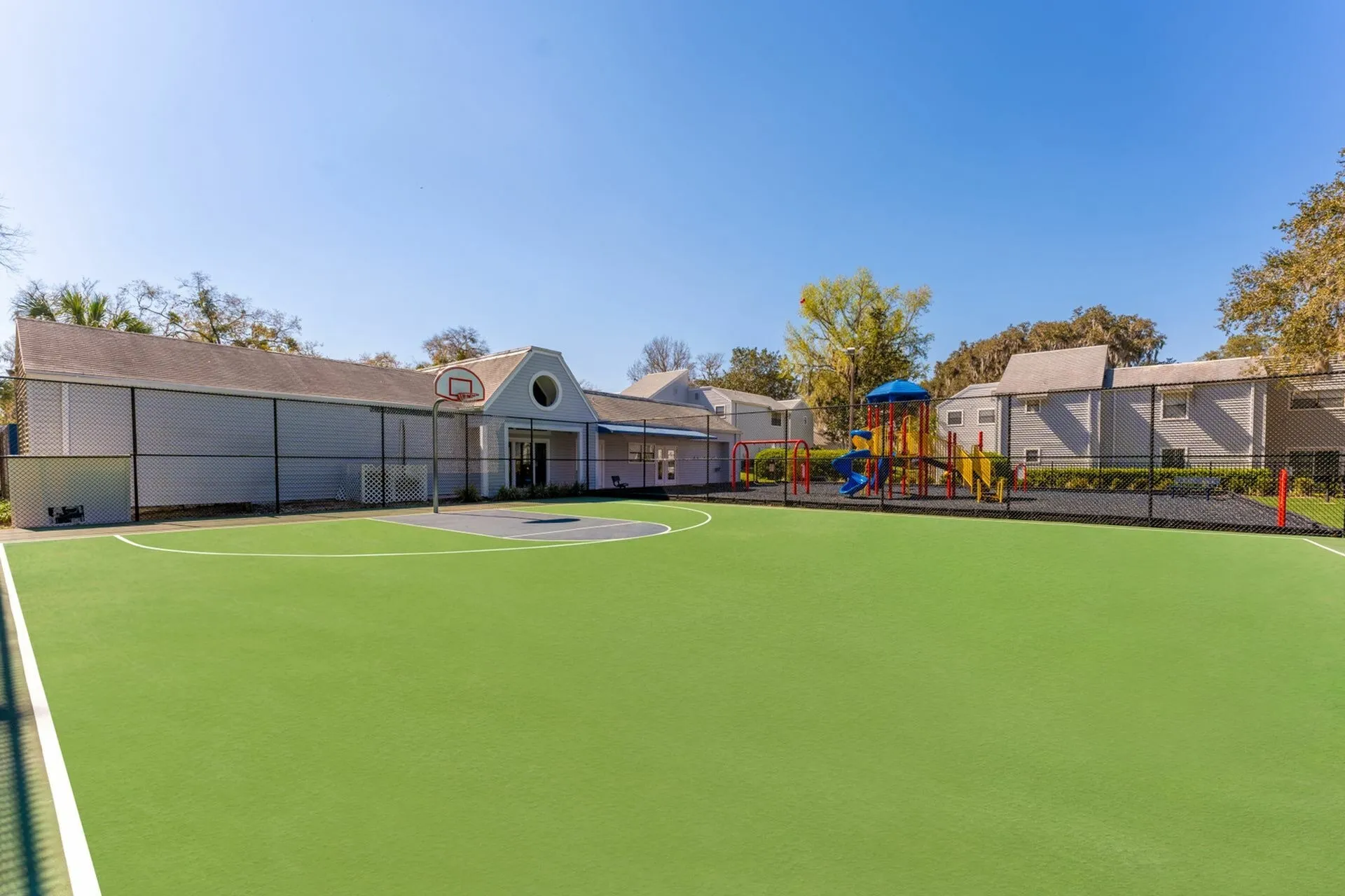 Basketball Court with playground in background
