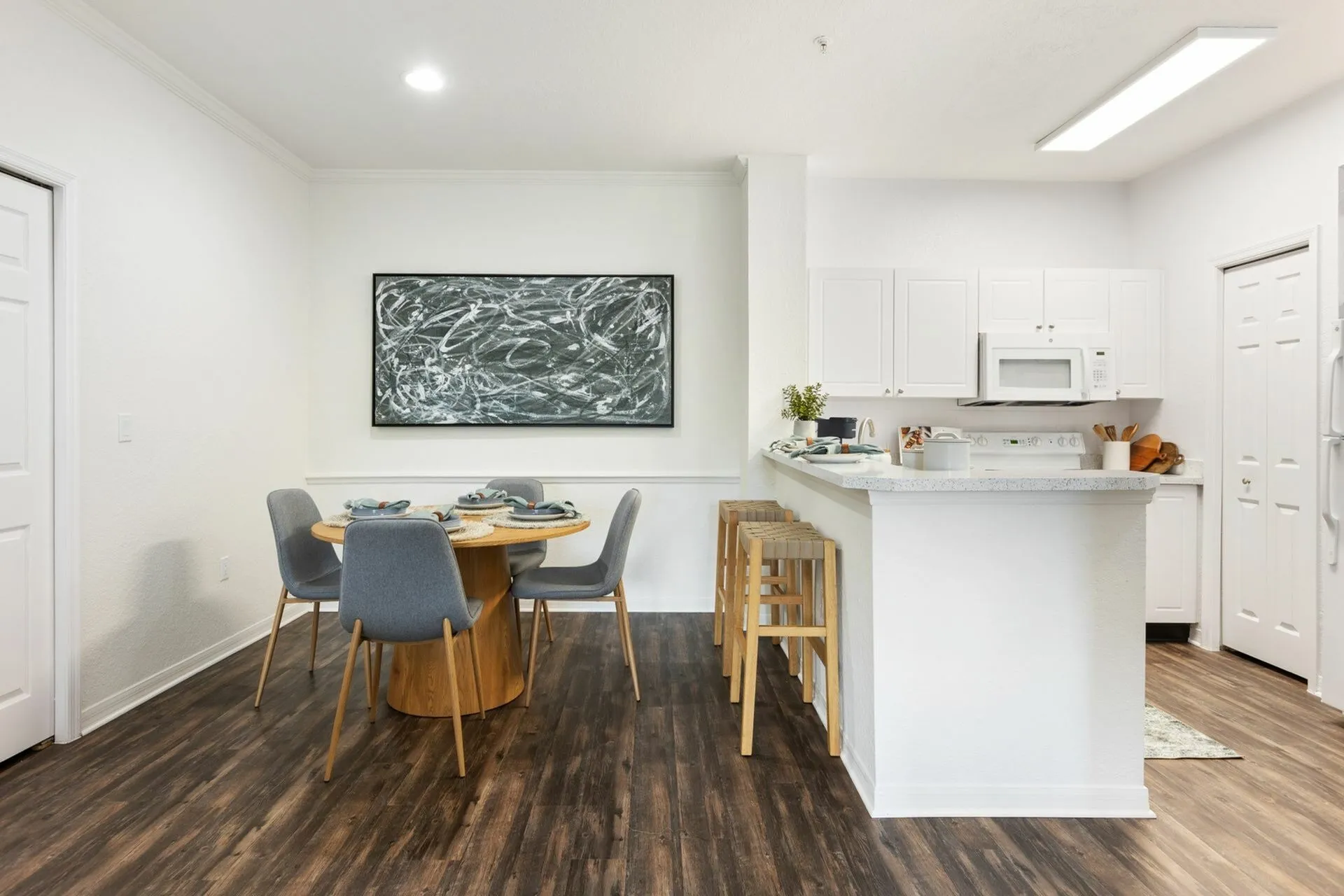 Kitchen with quartz countertops and dining area