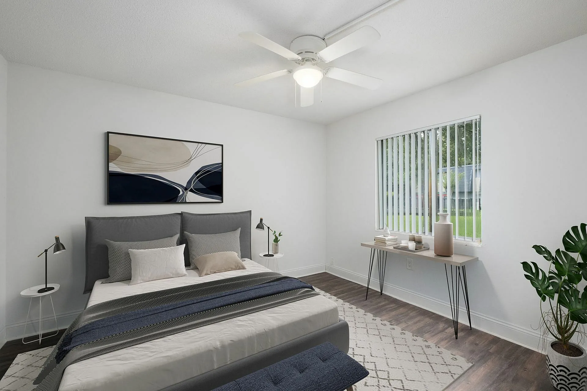 Bright, modern bedroom with stylish decor, a plush double bed, and natural light streaming through a large window.