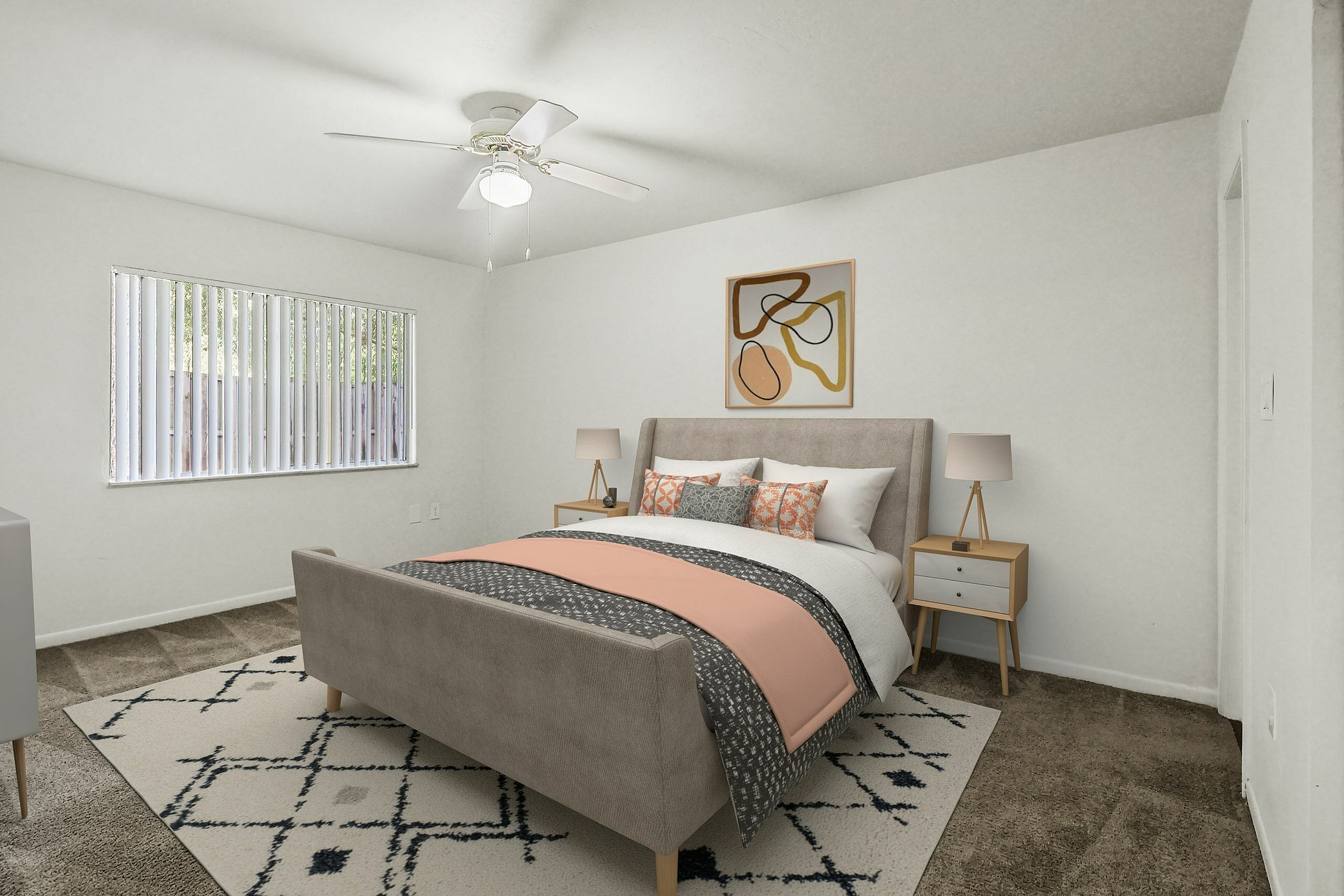 Inviting bedroom with a plush bed, stylish decor, and ample natural light through large windows.