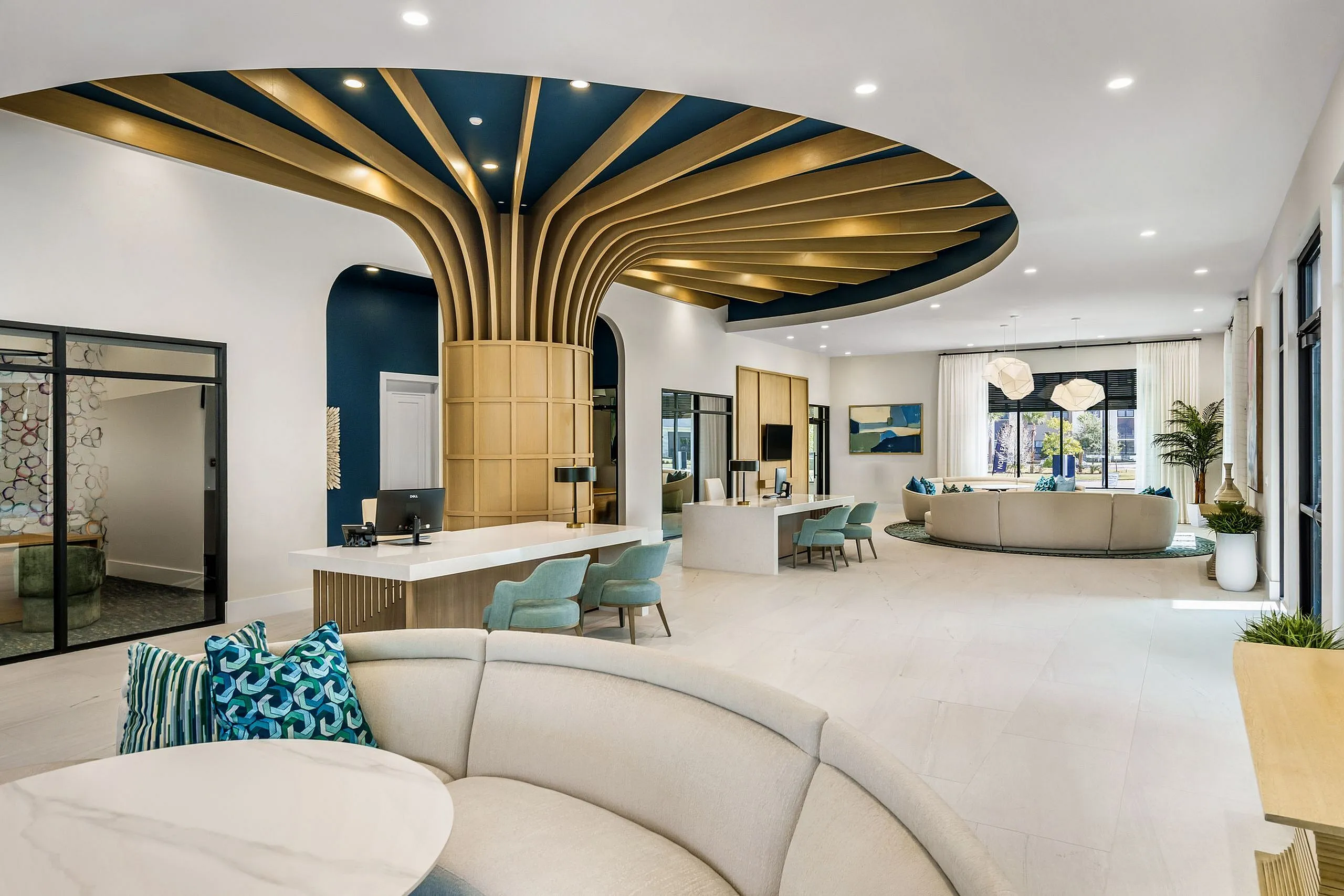 Luxurious apartment lobby with striking modern design, featuring a unique ceiling structure, chic seating areas, and elegant decor accents.
