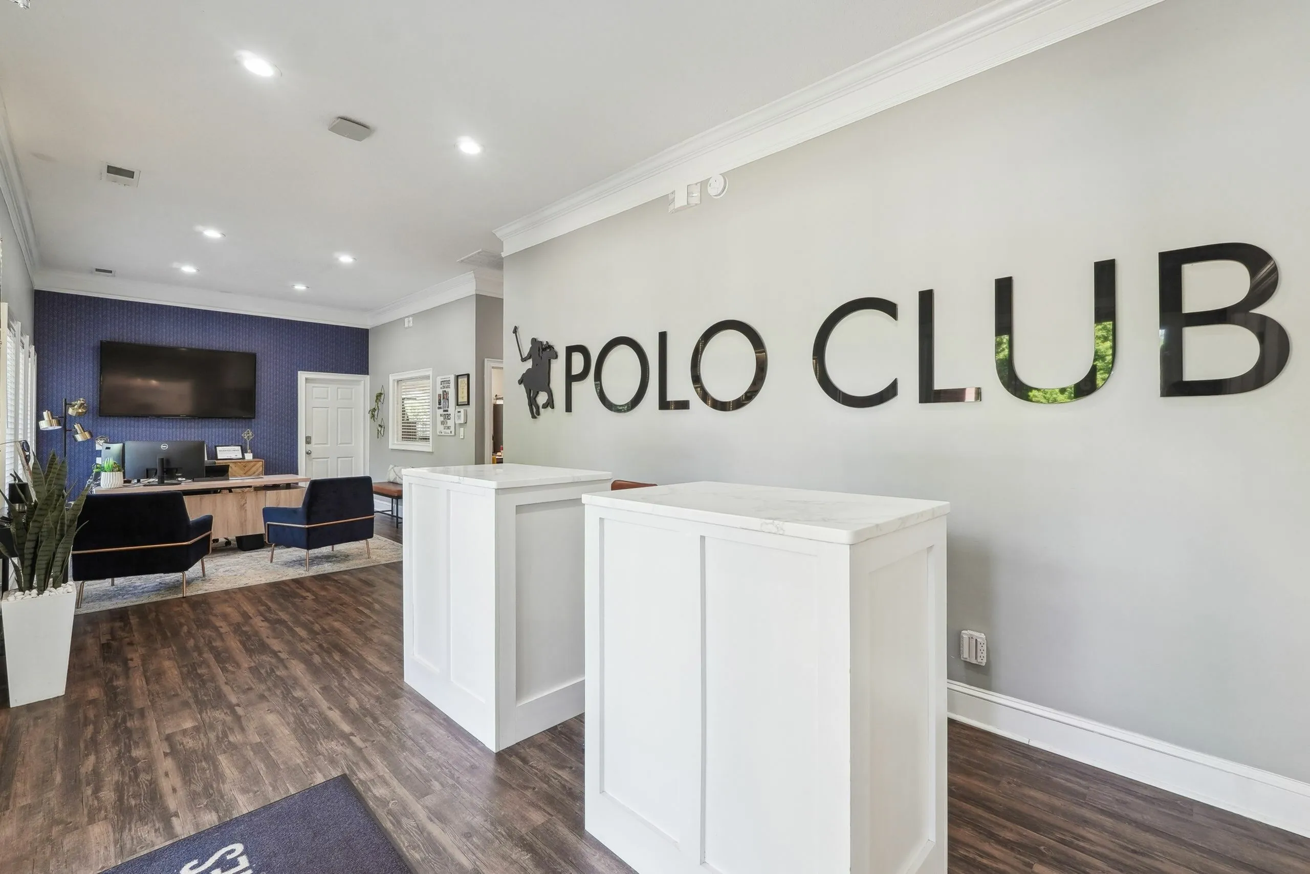 Elegant and welcoming lobby area of Polo Club featuring stylish furnishings, modern decor, and a sleek reception desk.