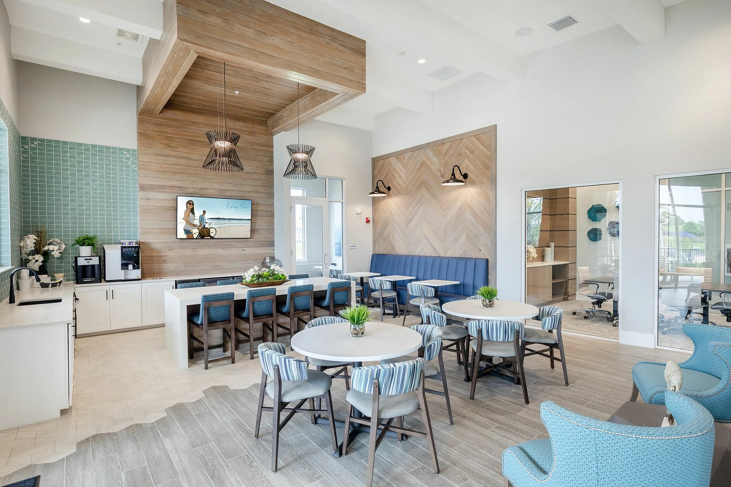 Modern apartment lounge with chic decor, featuring elegant seating, stylish wooden accents, and vibrant blue tiles. Ideal for relaxing or social gatherings.