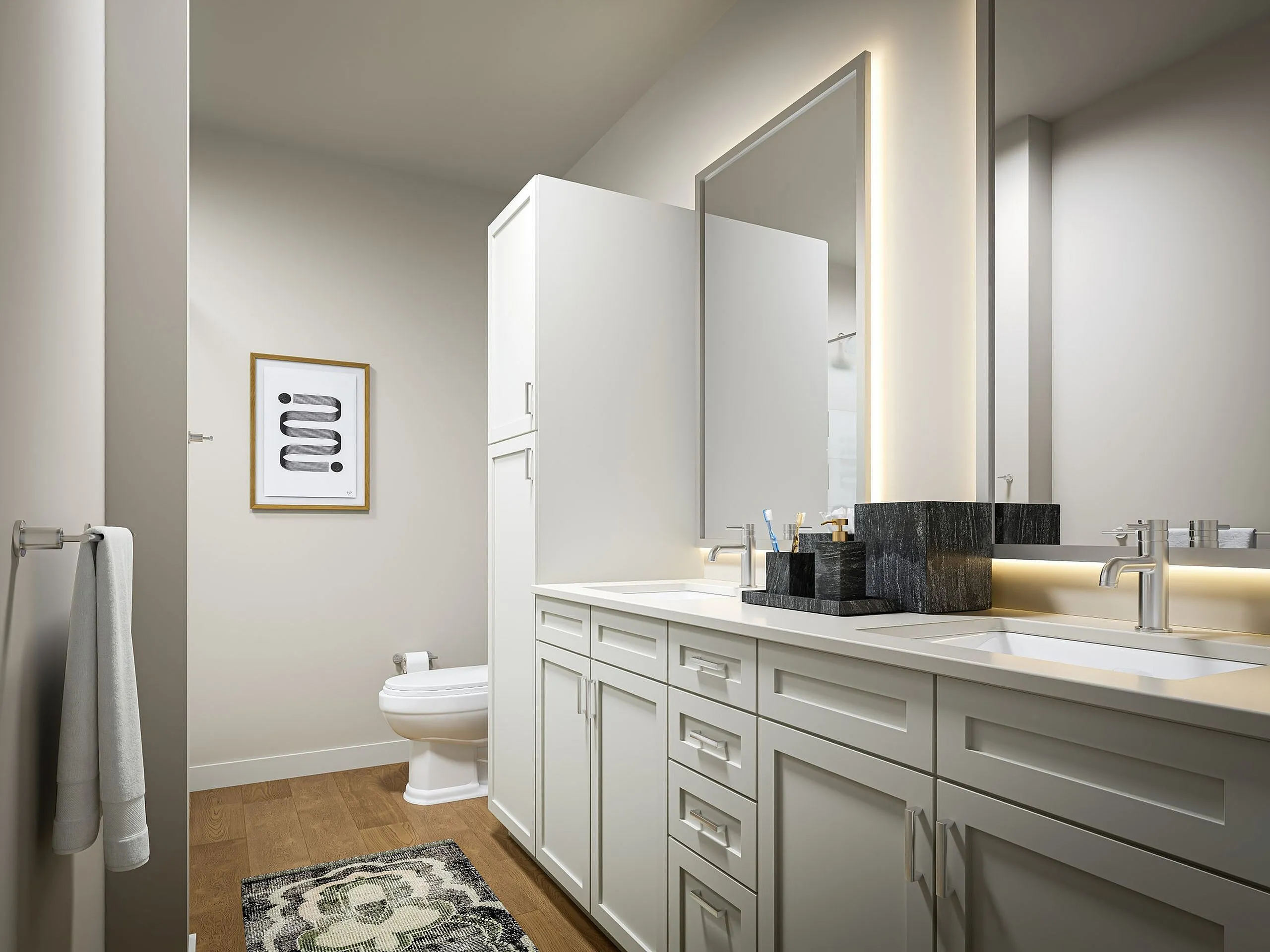 Elegant bathroom showcasing modern double sinks, sleek cabinetry, and ambient lighting with chic artwork.