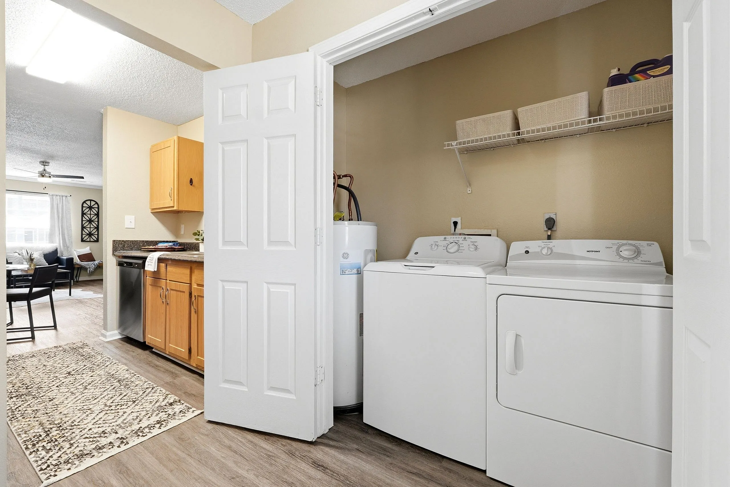 Spacious apartment with in-unit laundry and modern kitchen seamlessly connected to a bright, inviting living area.