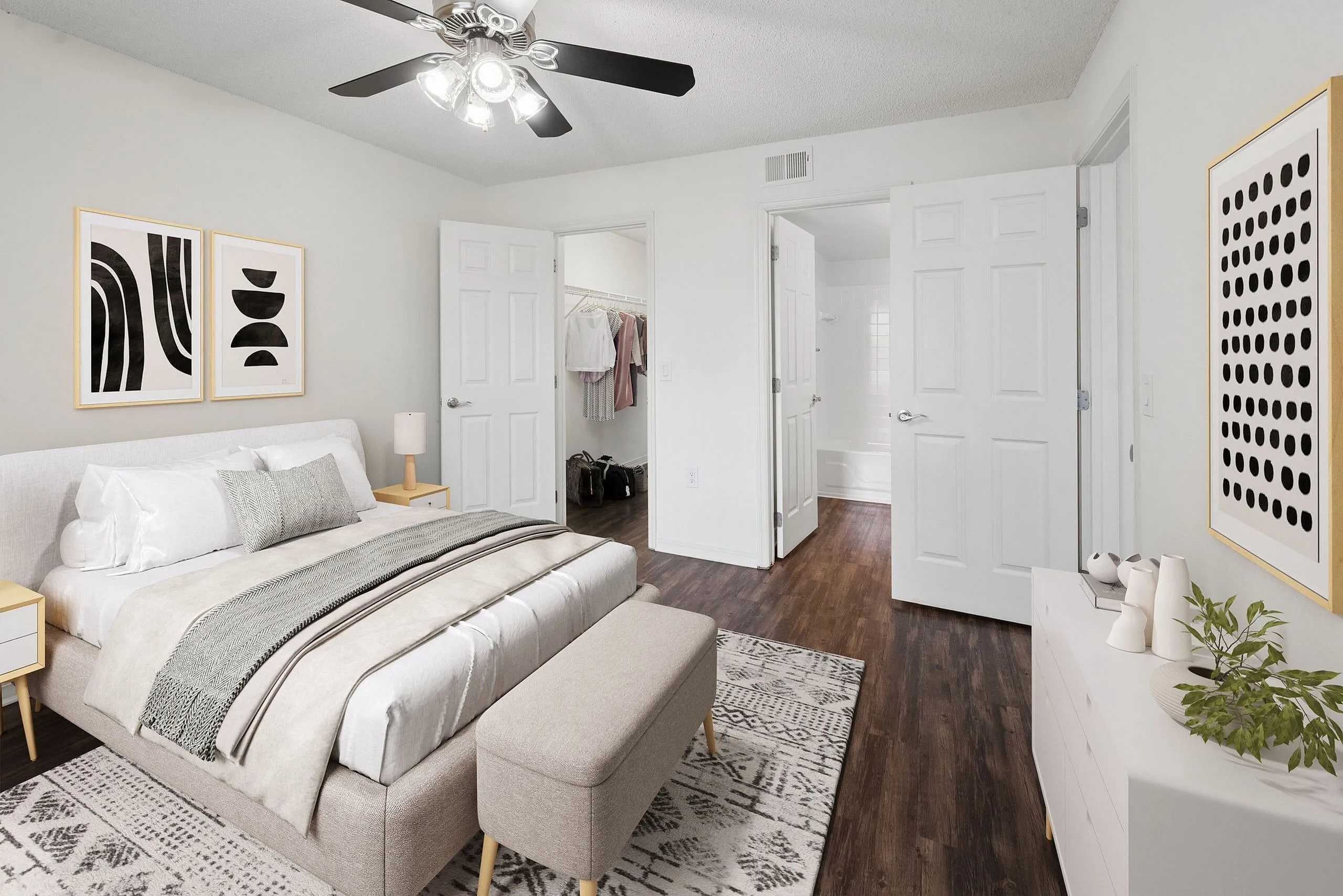 Elegant bedroom with modern decor, featuring a plush bed, stylish artwork, and a spacious walk-in closet.