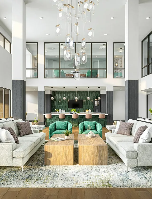 Luxurious modern living space with high ceilings, elegant chandeliers, and stylish seating in a sophisticated lounge area.