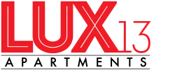 Bold red text logo featuring 'LUX13', showcasing a modern and stylish apartment branding.