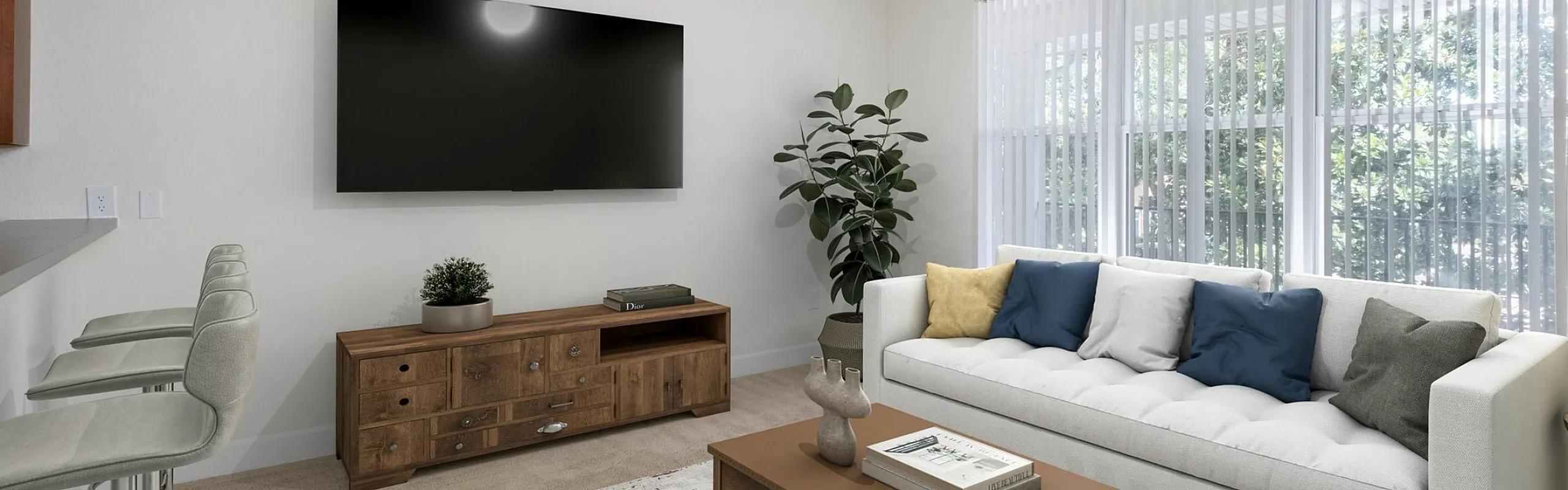 Bright living room with modern decor, featuring a cozy white sofa, stylish coffee table, and large flat-screen TV under soft natural light.