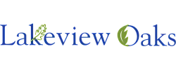 Elegant Lakeview Oaks logo with blue text and green leaf accents, symbolizing nature and tranquility.