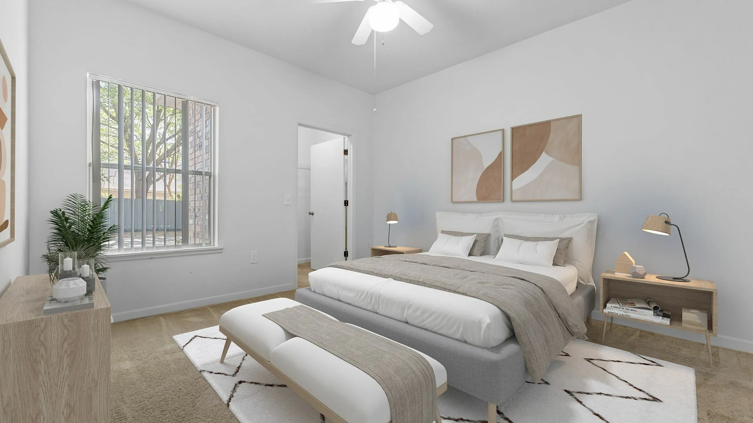Bright and cozy bedroom with modern decor, featuring a plush bed, stylish lamps, and natural light streaming through a large window.