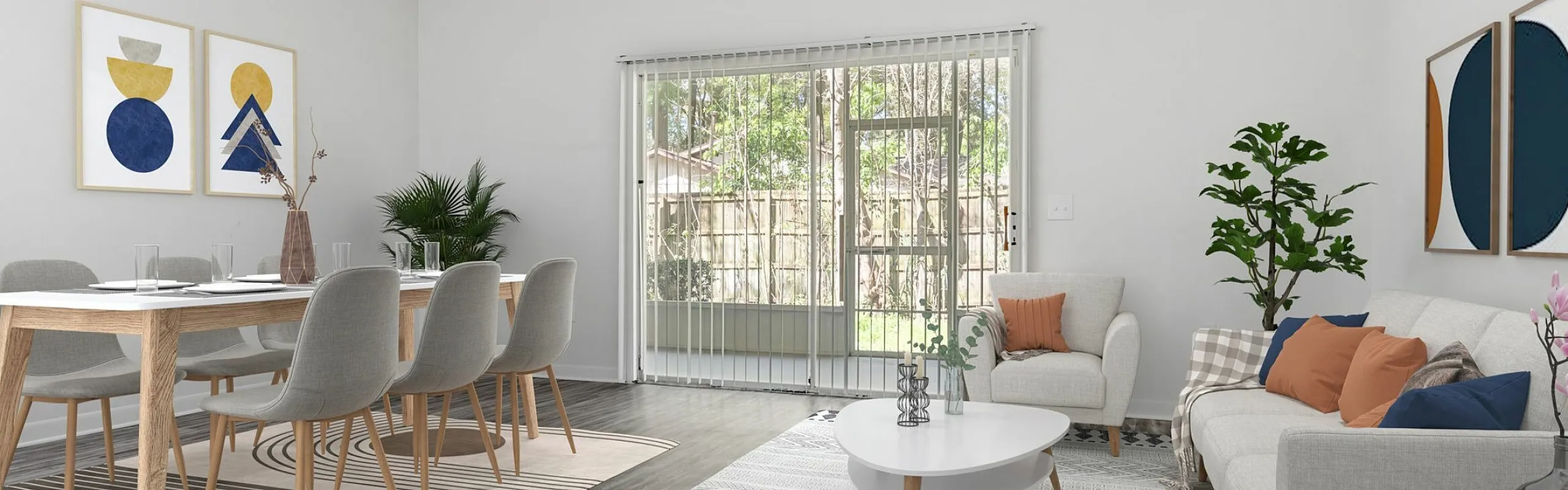 Bright, modern living and dining area with elegant furnishings, floor-to-ceiling windows, and chic decor featuring abstract art.