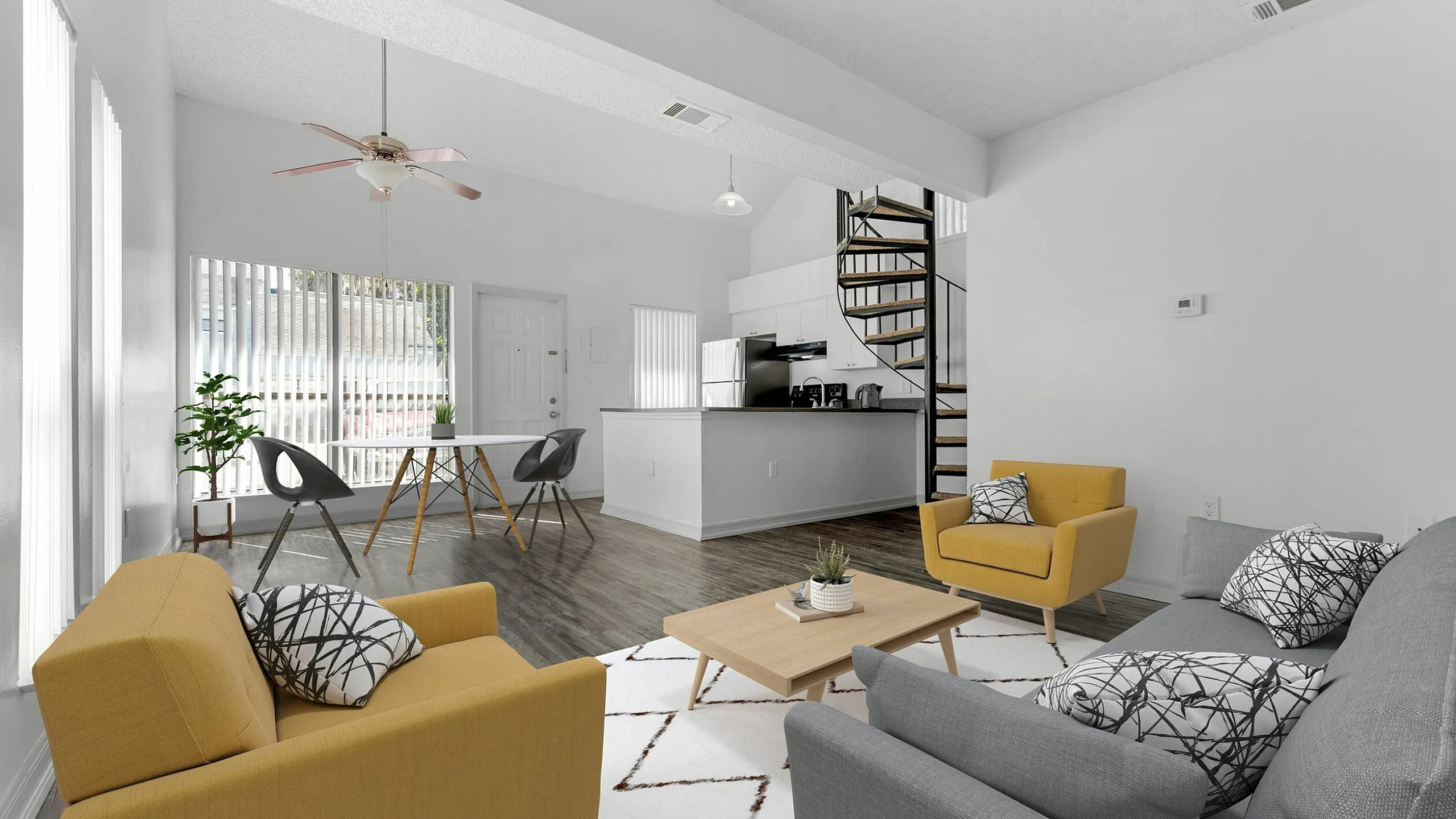 Chic modern apartment with open-concept living room, stylish kitchen, elegant spiral staircase, and bright dining area.