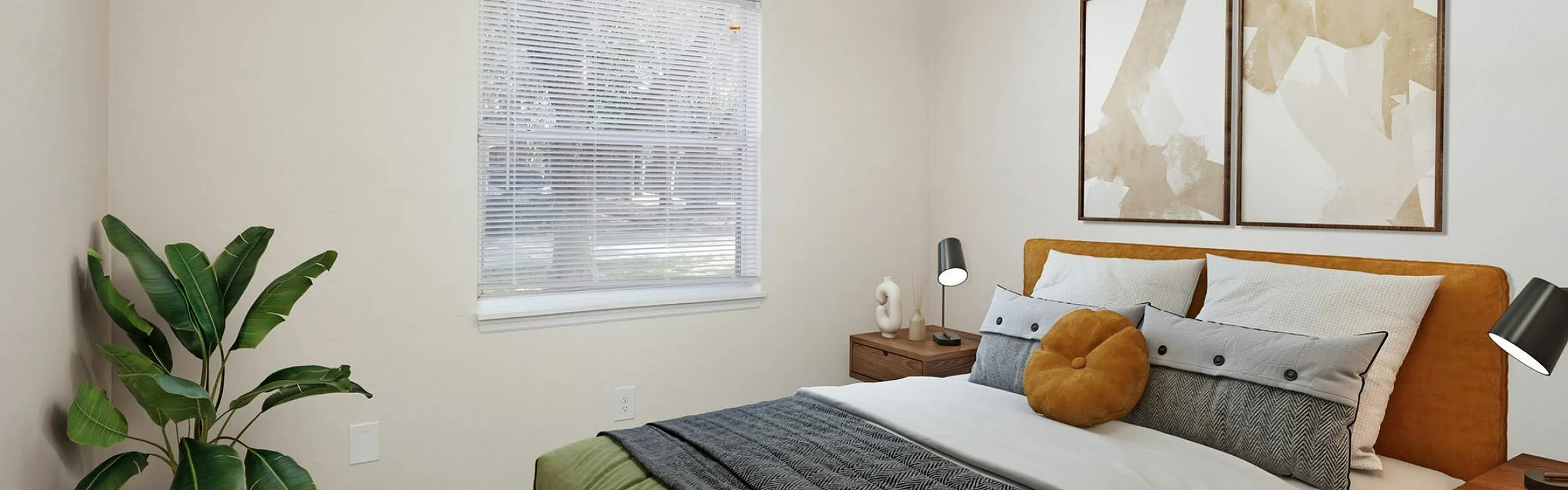 Inviting bedroom with a modern design featuring a cozy bed with stylish pillows, warm lighting, large window, elegant artwork, and a lush potted plant.