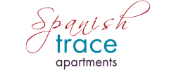 Elegant Spanish Trace Apartments logo with graceful script and modern typography.