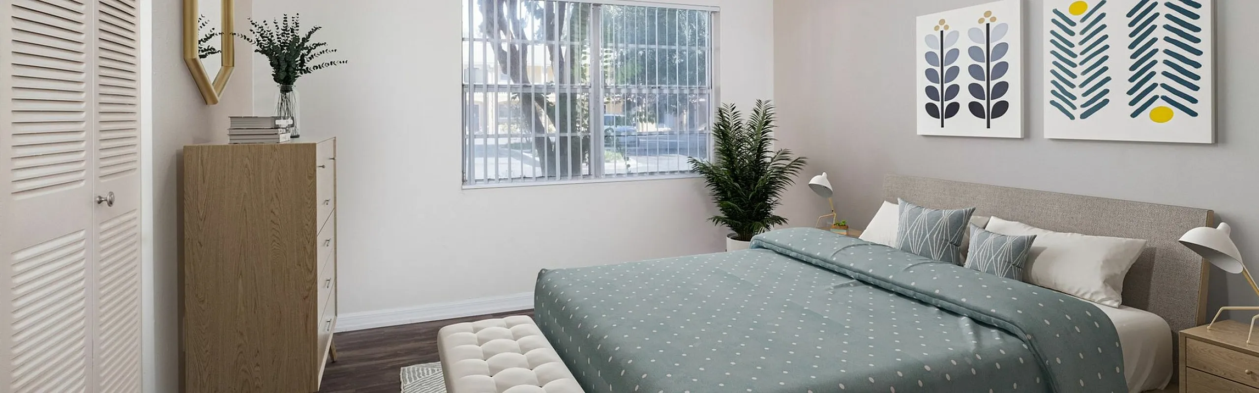 Modern bedroom with stylish decor, featuring a cozy bed, elegant artwork, and a large window for natural light.