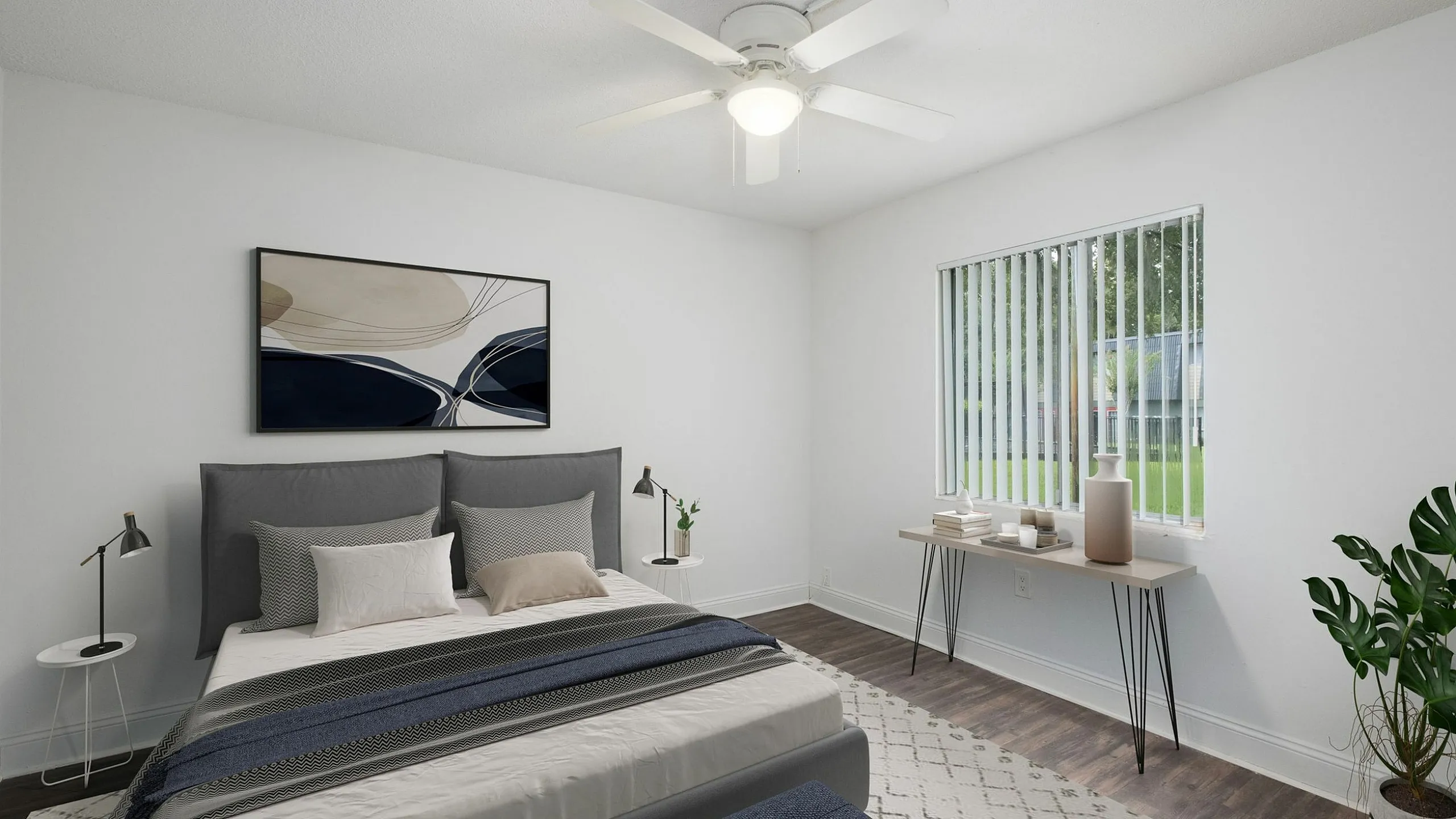 Bright and modern bedroom with elegant decor, featuring a cozy bed, minimalist desk, and vibrant plant.