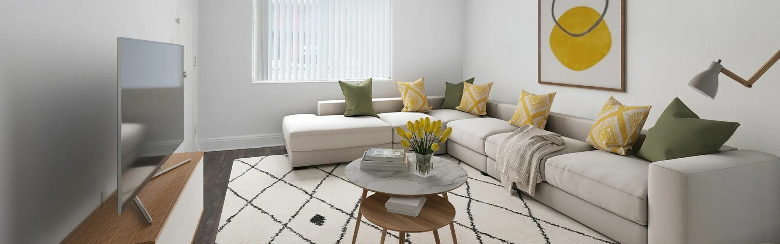 Inviting living room with modern d&eacute;cor, featuring a sleek sectional sofa, vibrant cushions, and a stylish coffee table on a chic patterned rug.