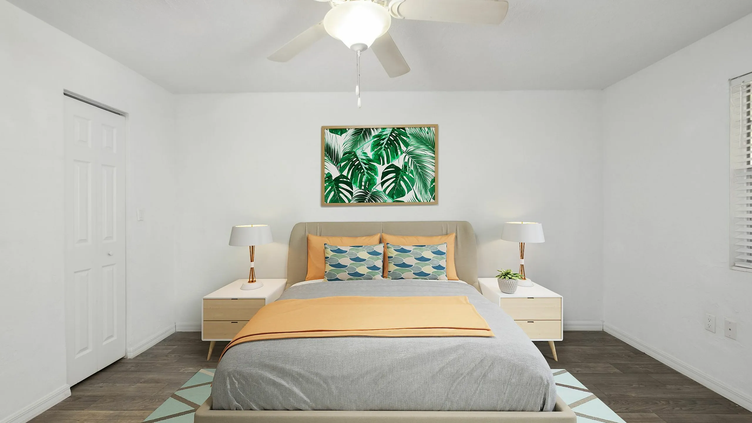 Bright and inviting bedroom with stylish decor, featuring a cozy bed, modern ceiling fan, and vibrant artwork.