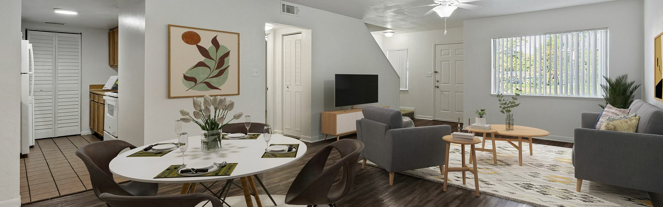 Chic open-plan living room and dining area with elegant furnishings, modern decor, and ample natural light.