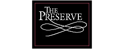 Elegant logo for The Preserve featuring sophisticated white script on a black background, framed with a subtle purple border.