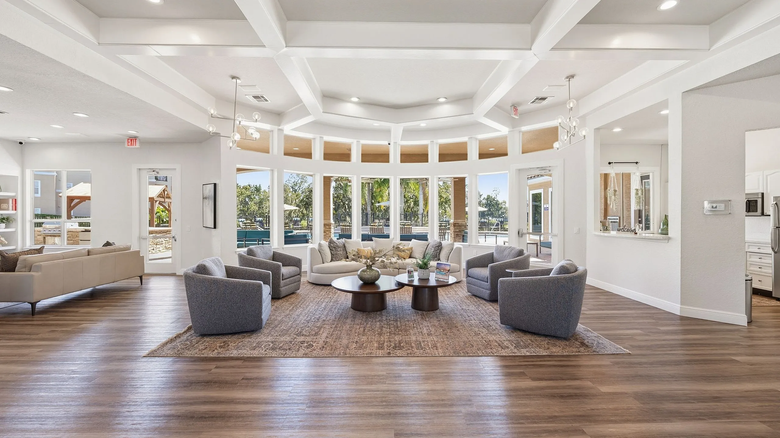 Elegant living area with modern furnishings, abundant natural light, and scenic window views, perfect for relaxation and entertaining.